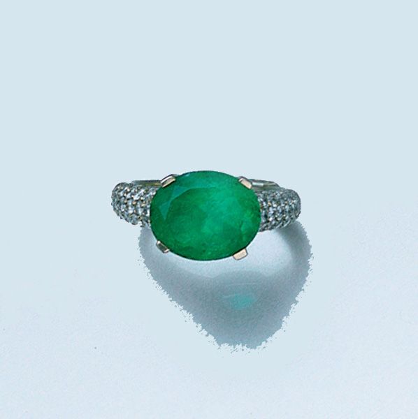 An emerald and diamond ring