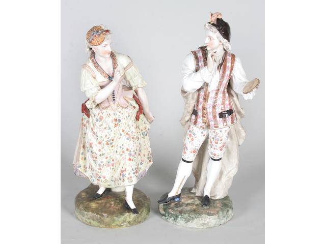 A pair of continental porcelain figures Late 19th Century,