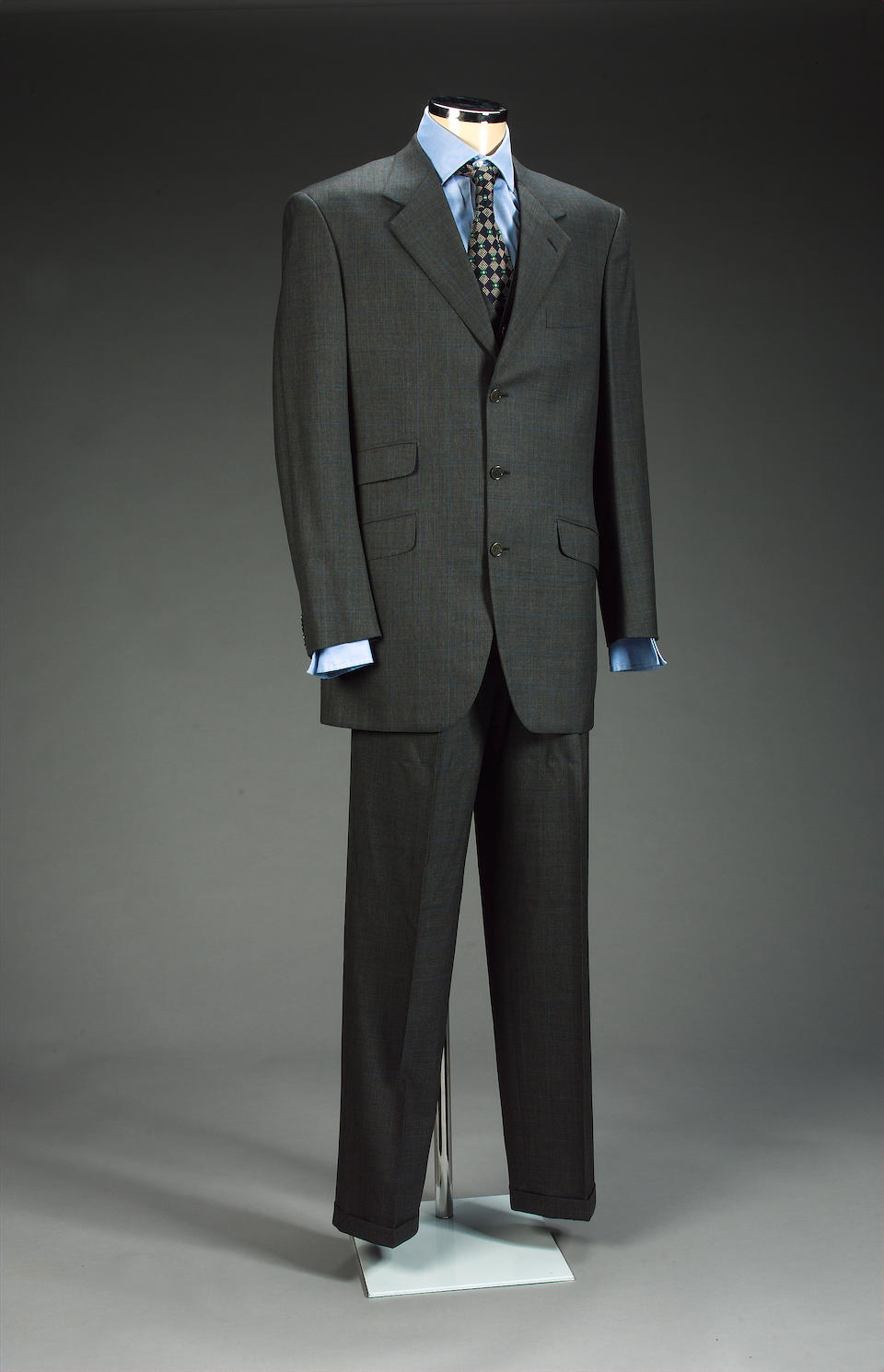 A Brioni grey three piece-suit, from Goldeneye 1996 as worn by Pierce Brosnan,