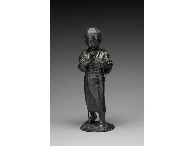 A bronze okimono cast as a standing boy,