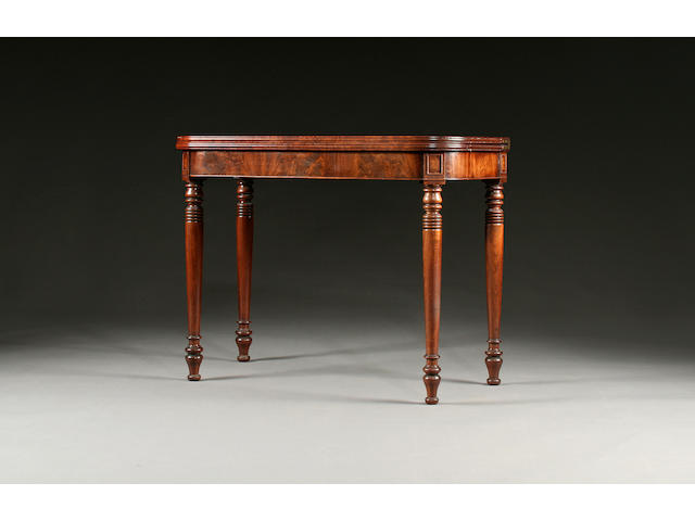An early 19th Century mahogany fold over tea table