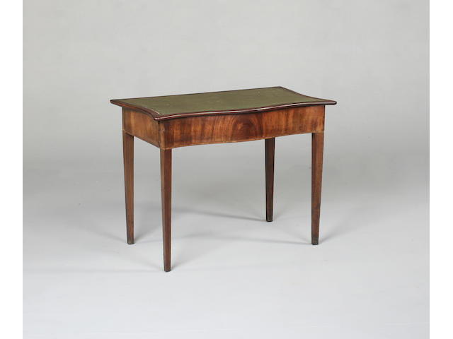 A George III mahogany serpentine side table