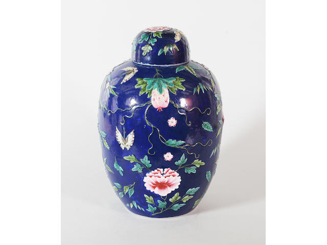 A Chinese relief decorated vase and cover Early 20th century
