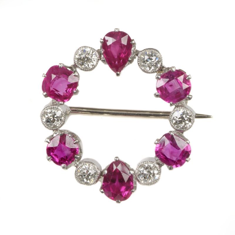 A ruby and diamond hoop brooch