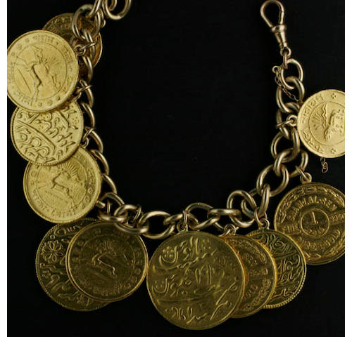 A solid curb-link bracelet supporting eleven coin charms The bracelet stamped '9,375', to swivel clasp, supporting Sham lal sen: &#189; tola (x2), 1 tola (x4) and British India (Murshidabad): mohur (x2) and &#189; mohur, all on pendant fittings,