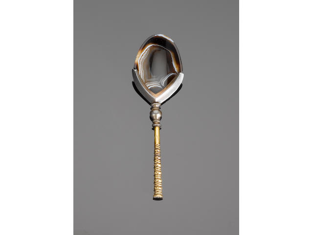A Roman banded agate cosmetic dish mounted as a spoon bearing an inscription with the name of Jahang