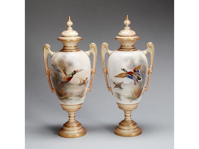 A pair of Royal Worcester vases and covers by JAS Stinton dated 1910,