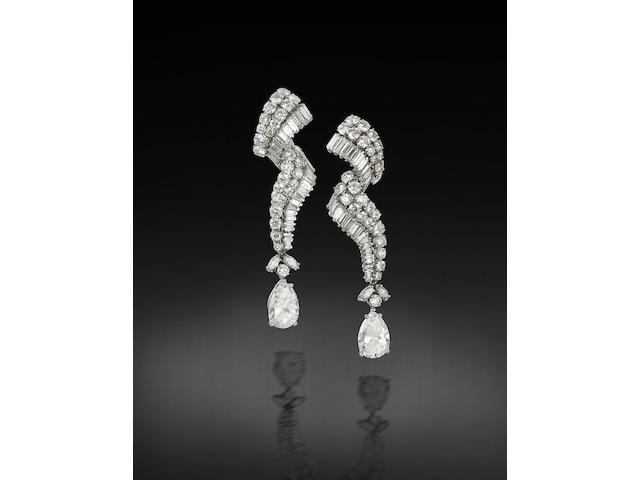 A fine pair of diamond pendent earrings,