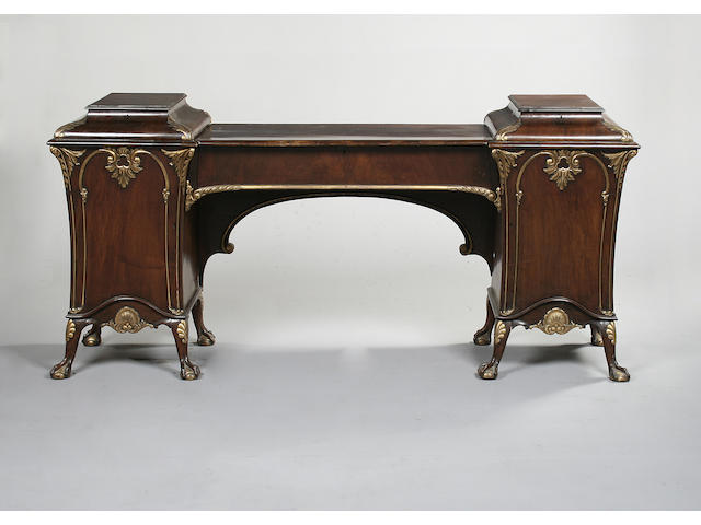 A late 19th century walnut and parcel gilt pedestal sideboard