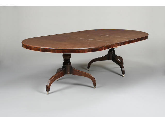 A 20th century mahogany twin pillar dining table