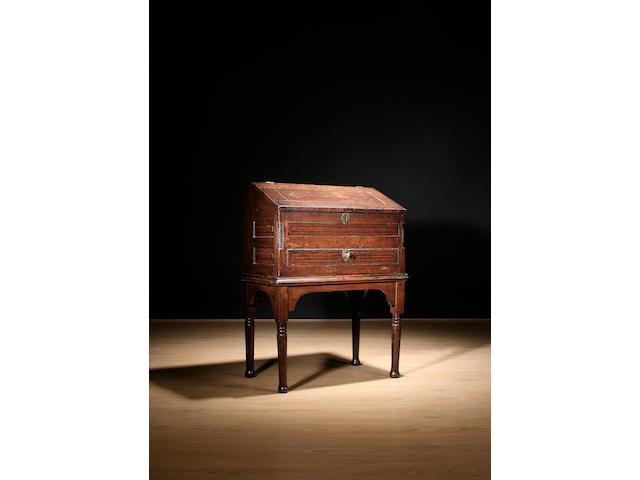 An early 19th Century oak and ebony strung desk box, on stand