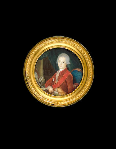 Russian School, circa 1775 A portrait miniature of Gavril Romanovich Derzhavin (1743-1816), seated in a library on a blue upholstered chair at a desk, wearing brown coat, yellow waistcoat, red sash and breast star of the Order of St. Anne and powdered wig worn en queue