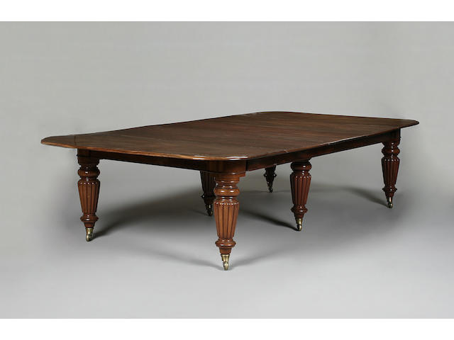 A large Victorian mahogany extending dining table