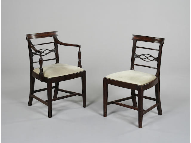 A set of seven George III mahogany dining chairs