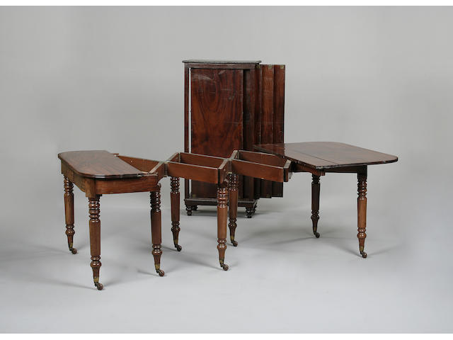 A late Regency mahogany concertina action dining table
