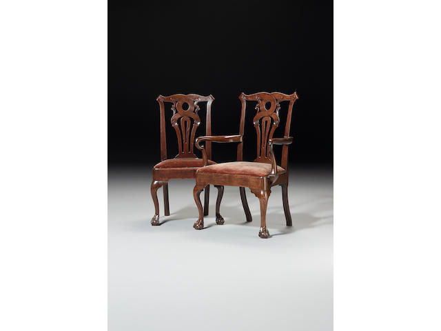 A set of eight George II mahogany Dining Chairs including a pair of Open Armchairs