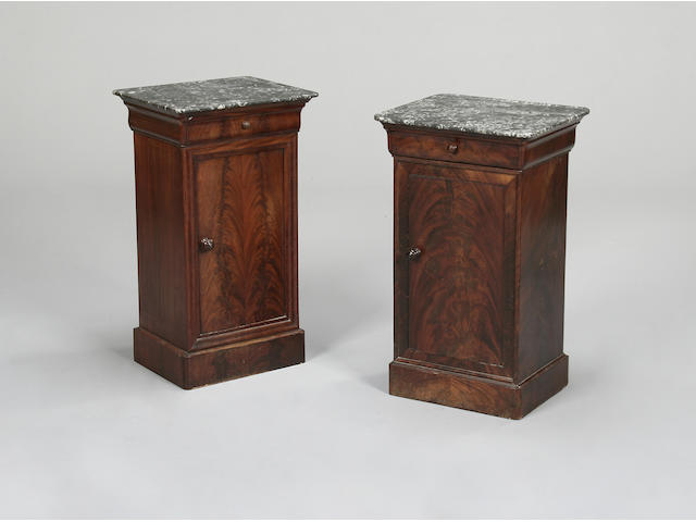 A matched pair of Louis Philippe mahogany tables de nuit