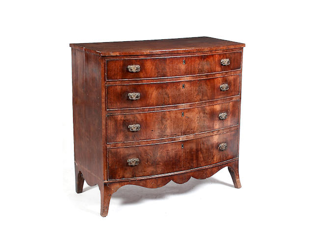 An early 19th century mahogany bow fronted chest