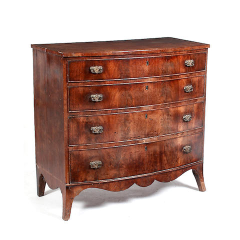 An early 19th century mahogany bow fronted chest