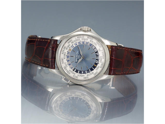 Patek Philippe. A very fine automatic  platinum World Time wristwatch with a platinum Patek Philippe deployant clasp together with  fitted box and a certificate of origin Ref 5110P, 3212492, Case No 4236474, Ref. 5110P. Sold November 2004.