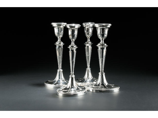 A set of four Edwardian candlesticks by Barker Bros., Chester 1907  (4)