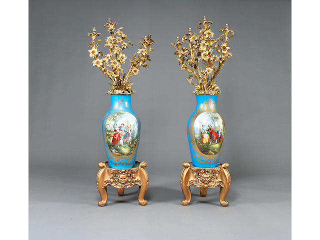 A pair of large and impressive S&#232;rves-style vases with ormolu lamp sconces