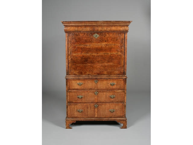 An early 18th century walnut crossbanded and featherbanded escritoire