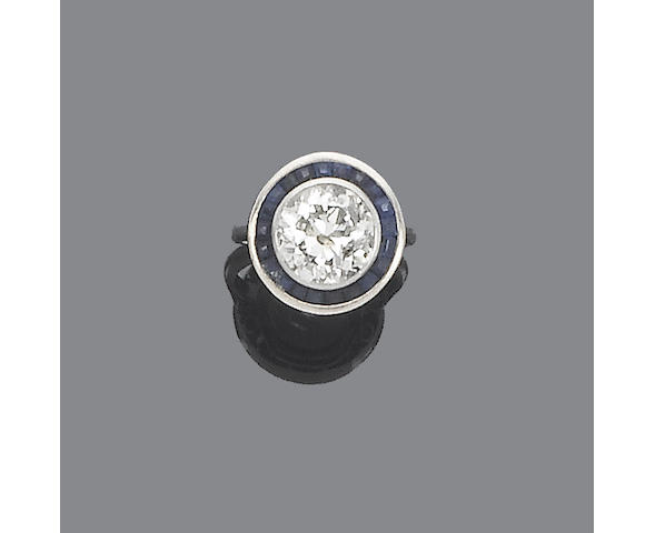 A sapphire and diamond target cluster ring,