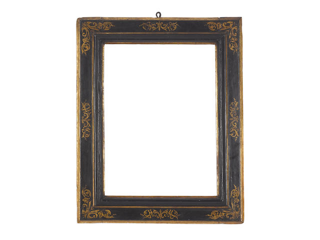 An Italian late 16th Century parcel-gilt and black painted cassetta frame