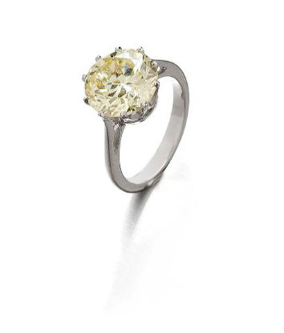 A yellow diamond single-stone ring