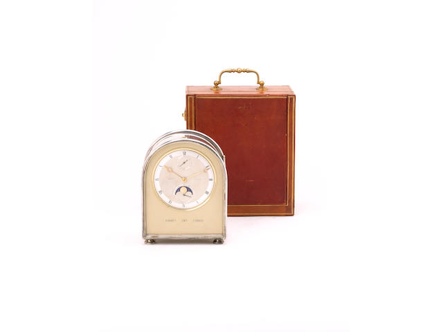 A very fine and rare mid 20th century French silver hump back cased petite sonnerie striking and repeating travelling clock with perpetual calendar, phases of the moon and up and down dial, in original travelling case Breguet, No 4456