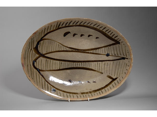 Michael Cardew an oval Platter Width 49cm (19 1/4in.)