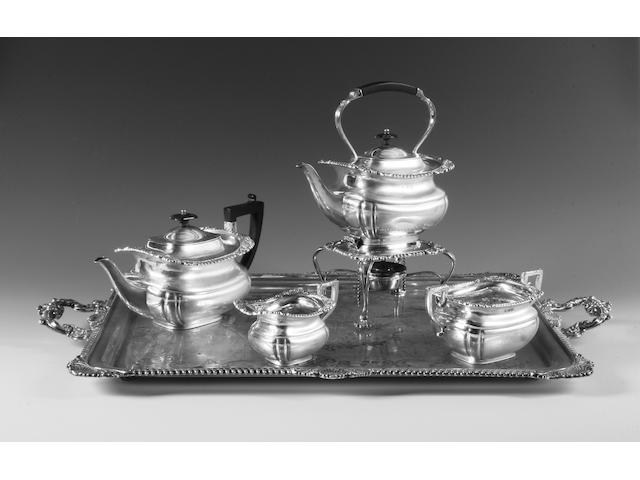 A four piece tea set and matching twin handled tray Sheffield, 1905 and 1907,  (6)