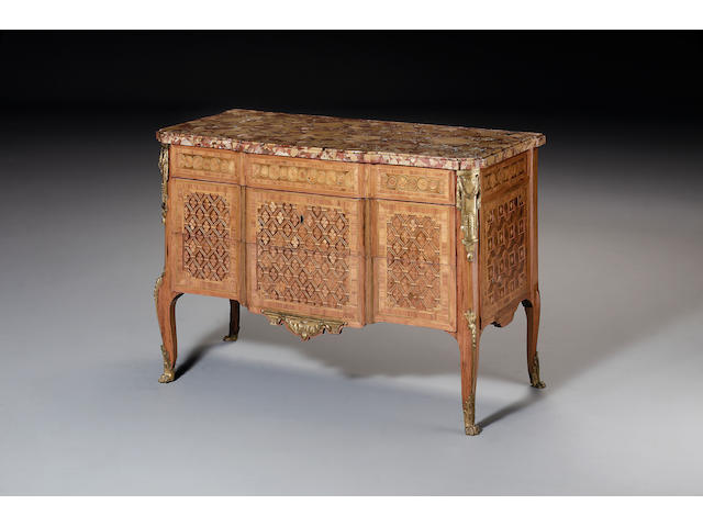 A Transitional kingwood, tulipwood crossbanded and sycamore marquetry commode By Pierre Denizot