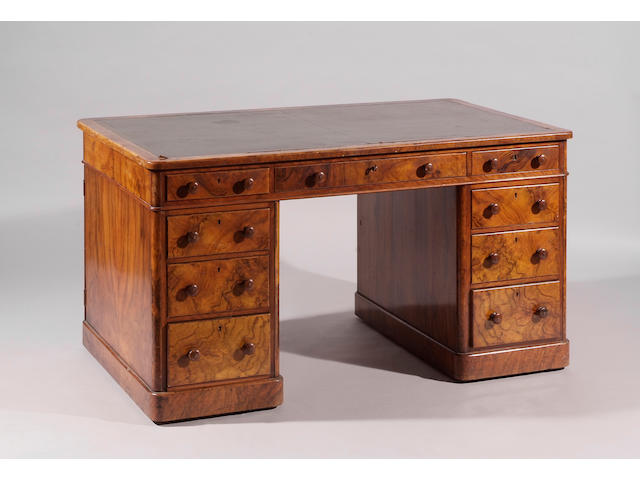 A Victorian figured walnut veneered twin pedestal desk