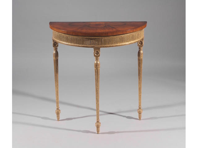 An inlaid satinwood and giltwood demi-lune console table