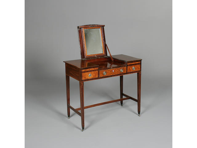A George III mahogany and satinwood enclosed dressing table