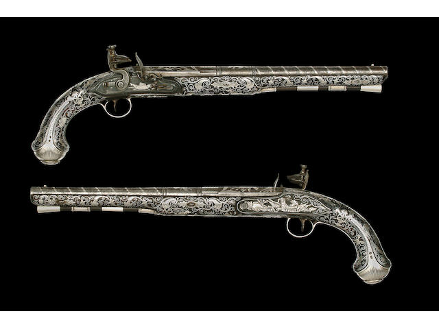 A Fine Pair Of Highly Decorated 20-Bore Silver-Mounted Flintlock Holster Pistols Of Presentation Quality