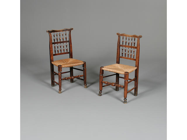 A matched set of eight late 19th Century fruitwood spindle back chairs