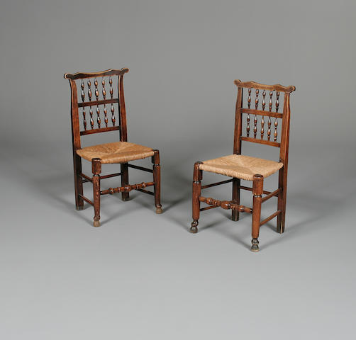 A matched set of eight late 19th Century fruitwood spindle back chairs