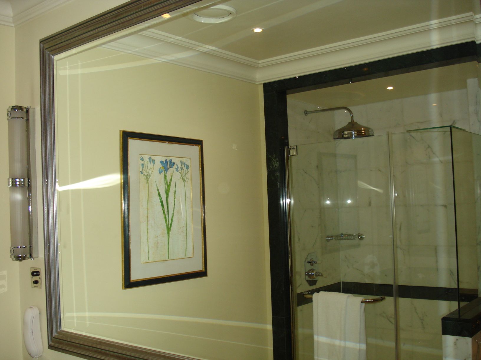 A large silvered framed rectangular wall mirror