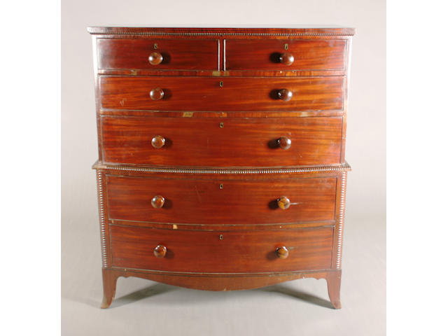 An early 19th century mahogany bow front chest-on-chest
