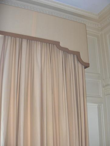 A pair of yellow and white striped curtains