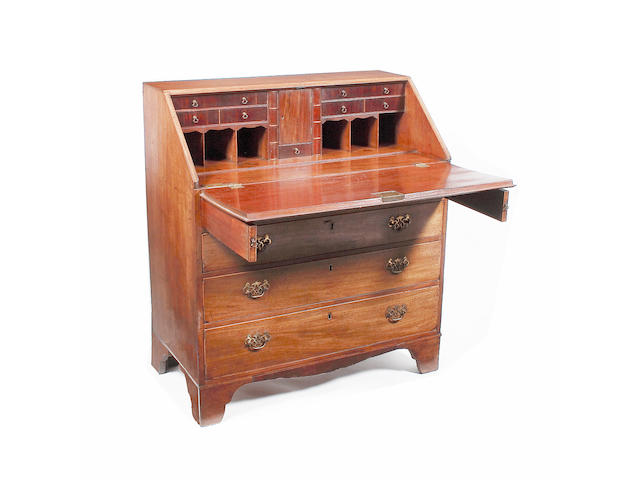 An early 19th century mahogany bureau,