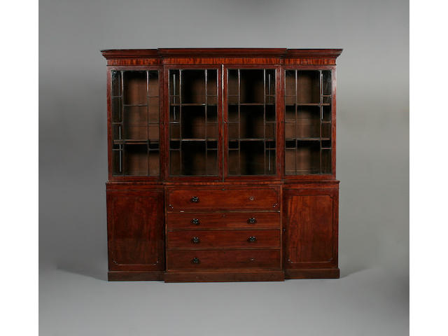 A George IV mahogany breakfront secretaire library bookcase