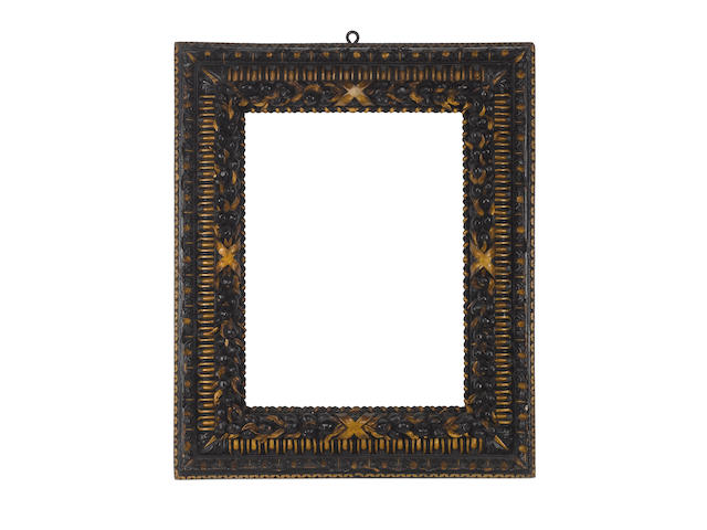An Italian 17th Century carved, parcel gilt and black painted frame