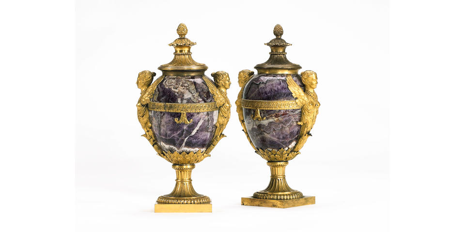 A pair of rare ormolu mounted banded amethyst quartz winged-figure Vases and Coverscirca 1772, designed by Matthew Boulton,