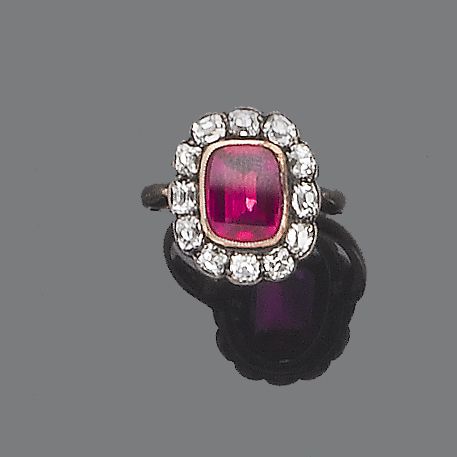 A synthetic ruby and diamond cluster ring,
