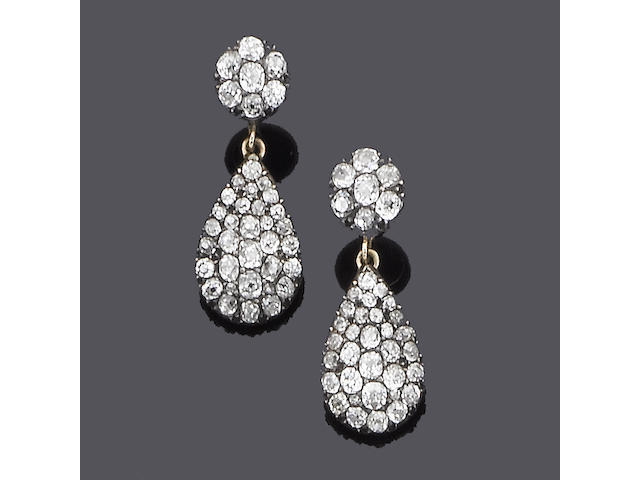 A pair of diamond pendent earrings,