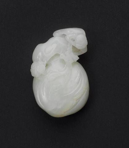 An almost white/pale celadon jade, carved as a monkey,
